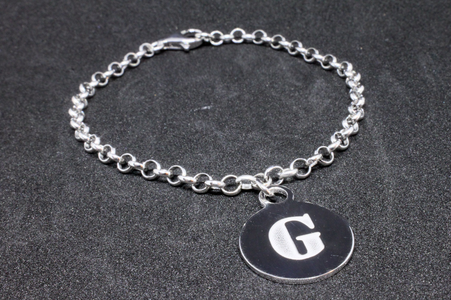 Silver rolo chain bracelet with initial medal Logo collection
